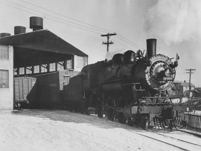 Steam railroad engine 1066 leaving Hamilton Manufacturing Company dock area on East Twin River