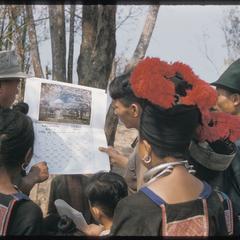 Hmong (Meo) and Inspector of Education with calendar