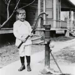 Boy with a water pump