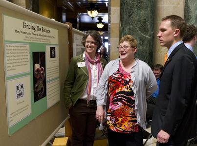 Lisa Hager and Student at Posters in the Rotunda