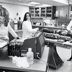 Three women in veterinary lab