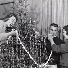 Hanging popcorn chains on a Christmas tree